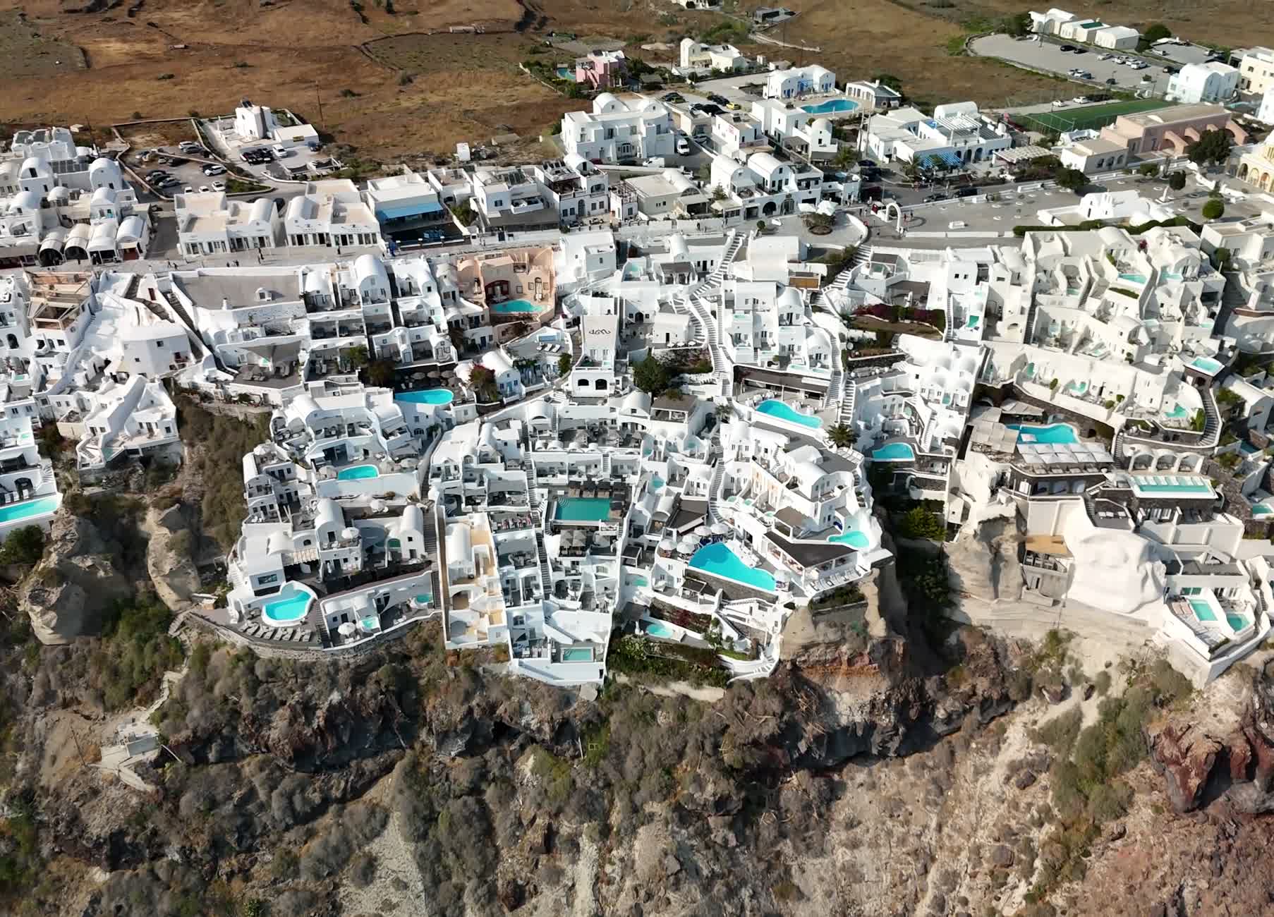 Whitewashed Santorini village stacked over the caldera: beautiful, and crowded