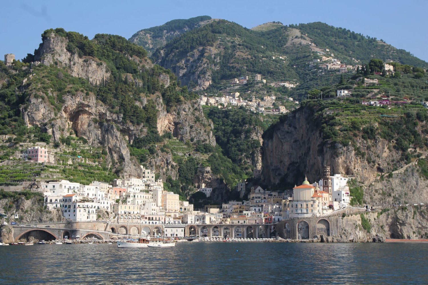 The town of Amalfi seen from the water, set against its cliffs
