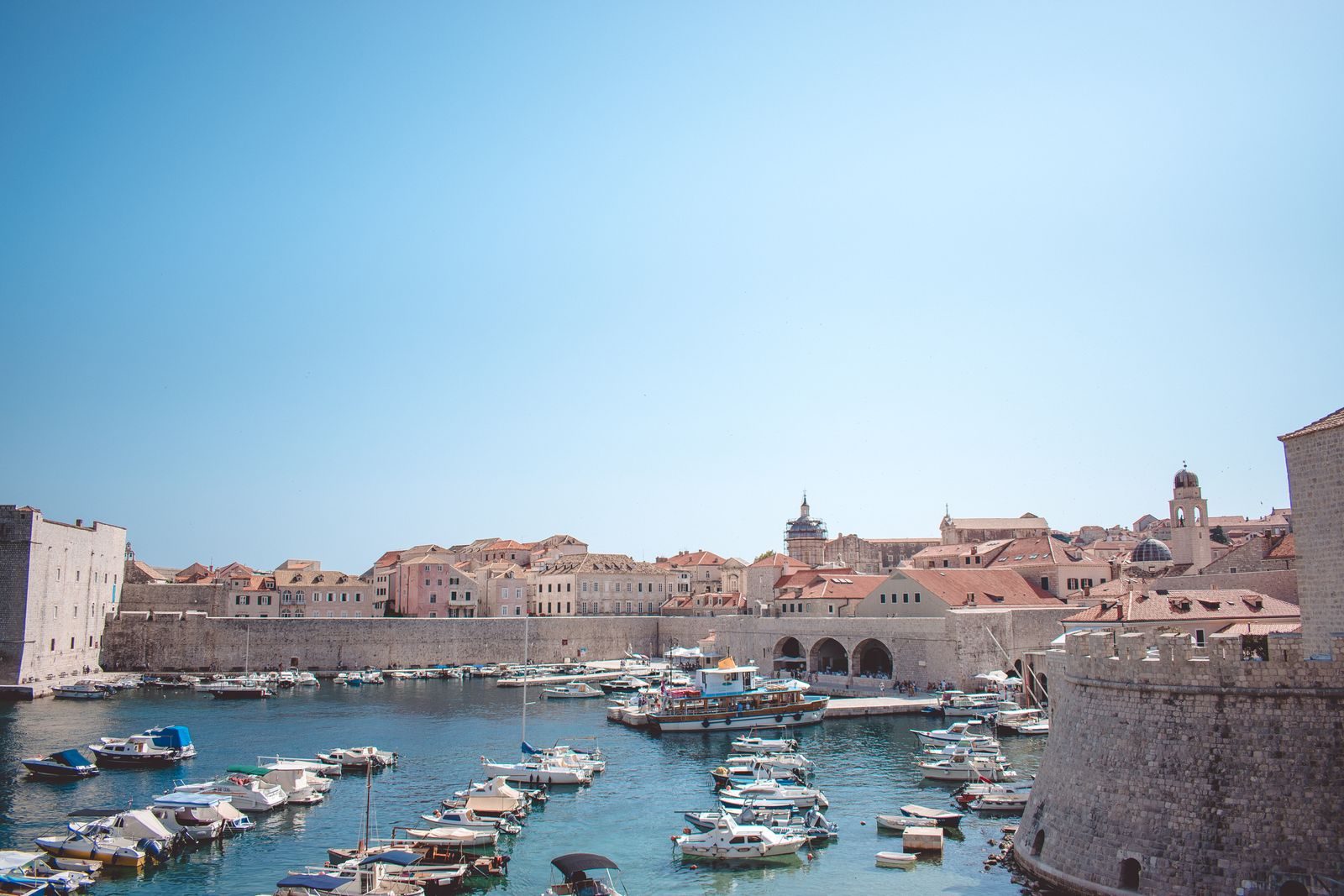 Boats in Dubrovnik's old harbour below the walls
