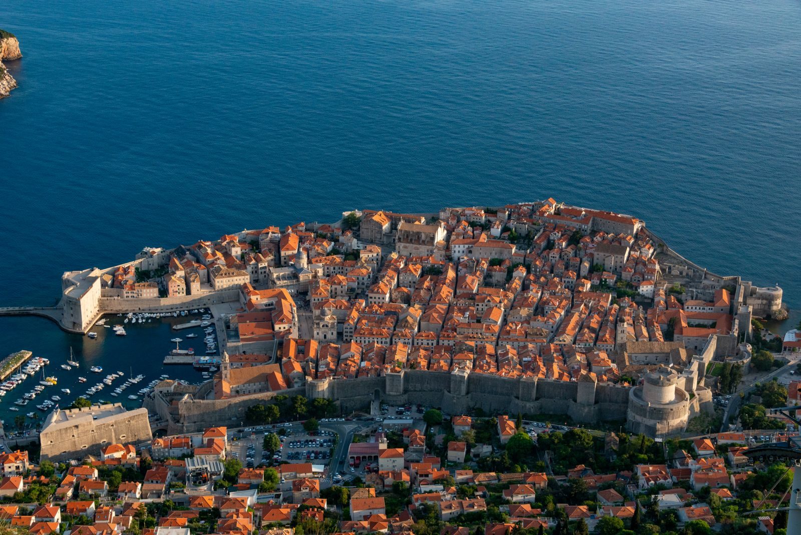 The walled Old Town of Dubrovnik and its red roofs above the Adriatic.