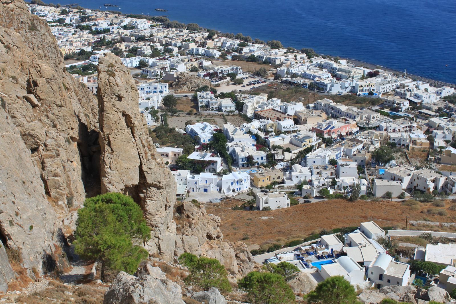 Kamari village and its black-sand beach seen from above